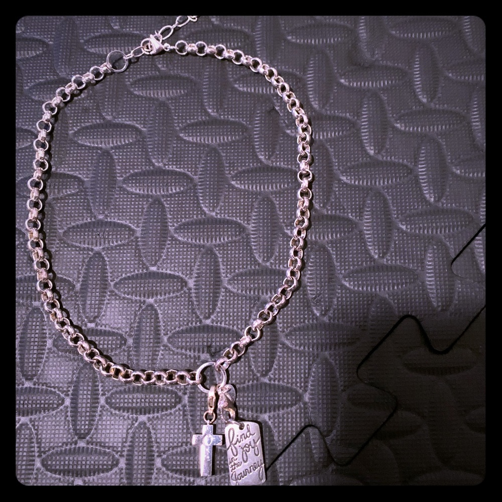 Sterling silver necklace with two charms.